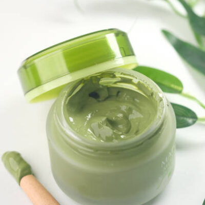 Bubble clay mask in container on white background .