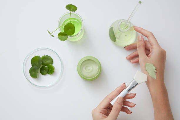 Hand posing with cosmetic , ingredient with color background